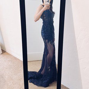 Custom-designed navy blue evening gown with lace appliqué